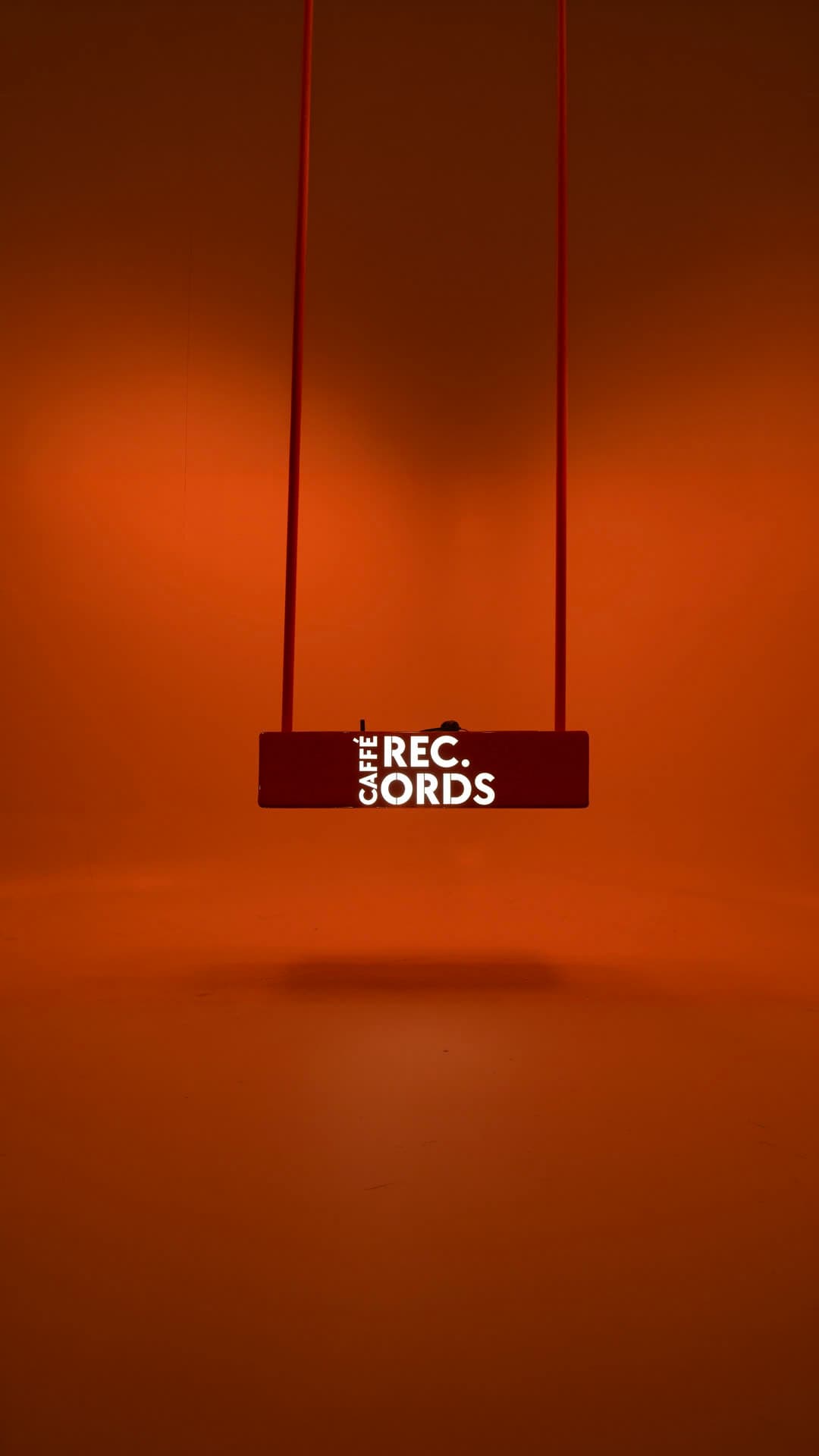Studio Caffé, the suspended Caffé Records sign in the orange room